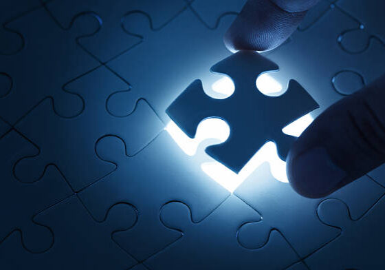 24-146 Business concept, male hand putting missing piece of jigsaw puzzle with copy space