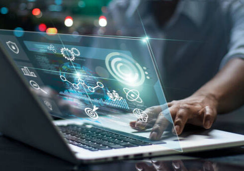 24-16 Data scientists. Male programmer using laptop analyzing and developing in various information on futuristic virtual interface screen. Algorithm. marketing and deep learning of artificial intelligence